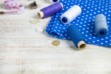 Sewing accessories and blue fabric