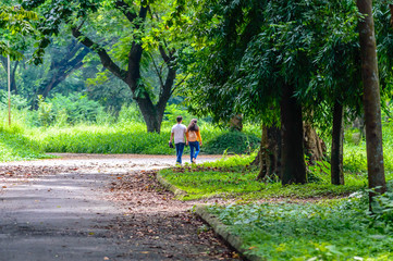 Happy married Cute couple walking in the park