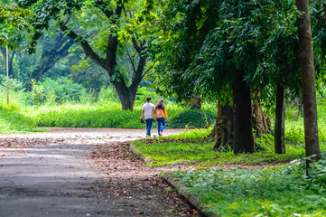 Fototapeta premium Happy married Cute couple walking in the park