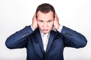 A young businessman covered his mouth with his hands. I can not listen to understand