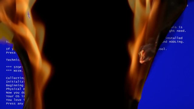 A funny fake BSOD (blue screen of death) failure message, recreated by me with a comedic meaning, slowly destroyed by intense flames.

