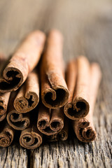 cinnamon sticks on a wooden background close-up