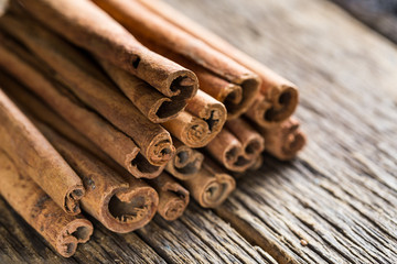 cinnamon sticks on a wooden background close-up
