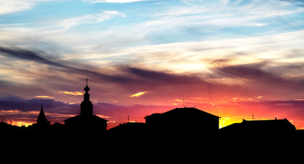 silhouette of religion buildings on color sunset