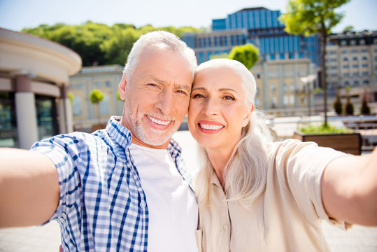 Portrait of stylish beautiful couple in casual outfits with beam