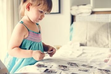 Little girl looking photos