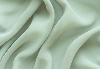  light green fabric with large folds, delicate background