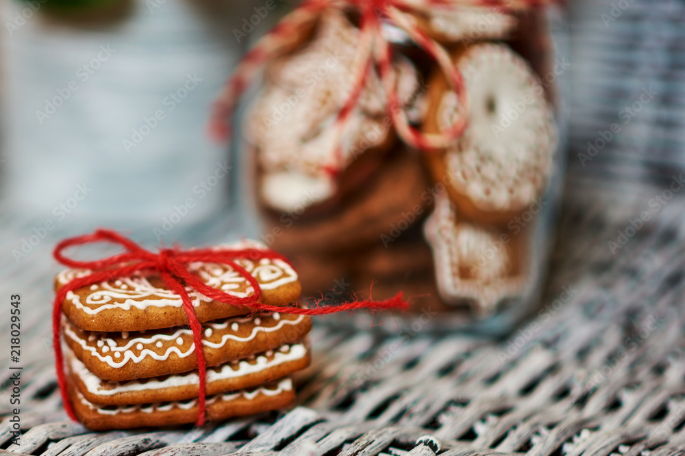 Wall mural Pile of gingerbread cookies tied with a Christmas ribbon.