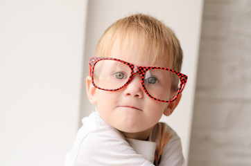 blond boy with glasses closeup