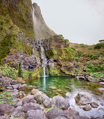 Panoramic view of pond and waterfall Poco do Bacalhau at the Azores island of Flores