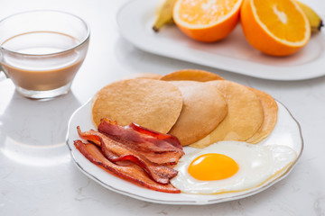 Healthy Full American Breakfast with Eggs Bacon and Pancakes