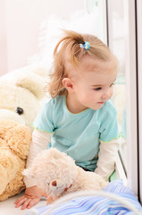 little girl looking out the window