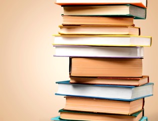 Colorful books collection on classroom background