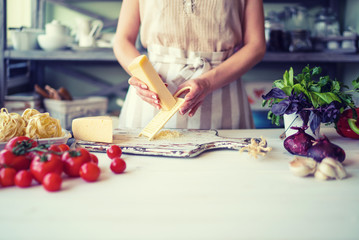 Chef cooking. Food, kitchen, home, cutting, cook, hands, women, female, knife, preparation, fresh, preparing concept. Young woman in the kitchen preparing the dine while cooking in kitchen at home.