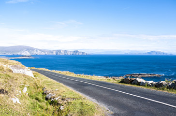 Ocean road with the Minaun Cliffs in the background. Taken on a sunny summer day on Achill Island...