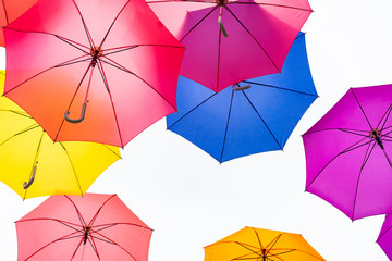 Colorful umbrellas background. Colorful umbrellas in the sky. Street decoration. © sutthinon602
