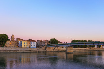 Evening panoramic view of the French city of Arles on the River Rhône. Provence. France.