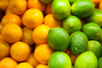 Green lime and tangerines in the shop window in the store