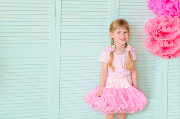 girl with pigtails, wearing a skirt tutu