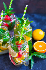 Fresh lemonade jar with mint, summer fruits and berries