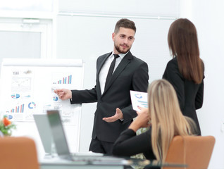 businessman makes a presentation to his business team