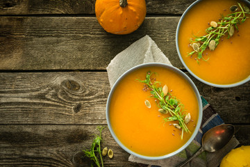 Pumpkin soup with pea micro green and seeds