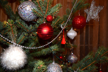 Christmas decoration. Fir tree with red, white and silver balls