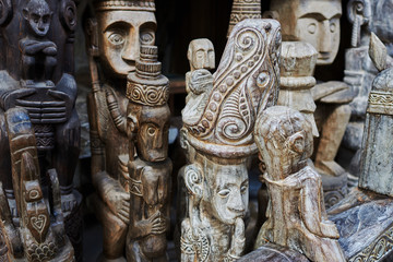 Different wooden Balinese souvenirs displayed in art and craft tourist market. Indonesian handicrafts. Souvenir from Bali. Traditional product of handicraft. Typical souvenirs at the famous market..