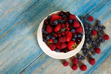 Cook in a coffee shop prepared for its guests easy berry dessert with a minimum amount of calories, fresh and tasty