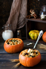 Millet porridge with raisins in pumpkin