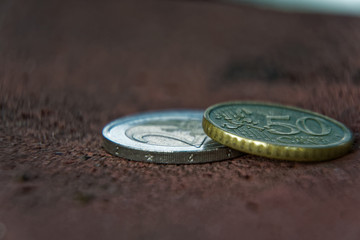 Business concept, macro Two euro coin and 50 cents