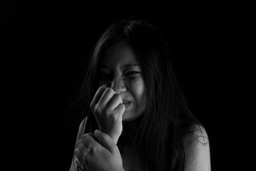 Human trafficking concept, End to violence against women, Scared woman with man's hand covering her...