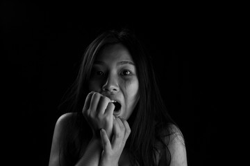 Human trafficking concept, End to violence against women, Scared woman with man's hand covering her...