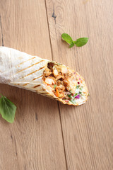 Fototapeta na wymiar shaurma kebab on a wooden background