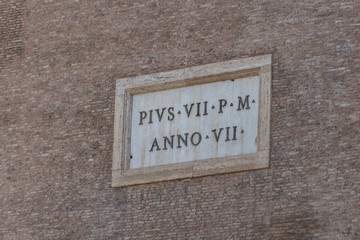 Fototapeta premium Exterior of the Colosseum in Rome, east side, with Pius VII P M - Anno VII sign