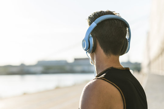 Young man with headphones looking at distance