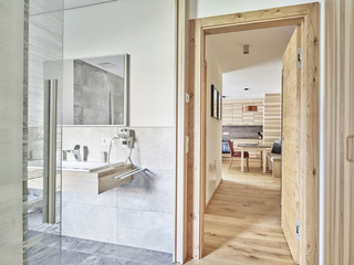 Interior of open plan kitchen and bathroom of a holiday home