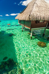 Over water bungalows and green lagoon, Moorea, French Polynesia
