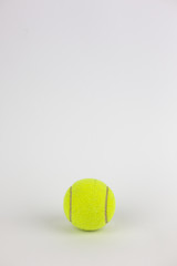 close-up of single tennis ball isolated on white background