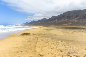 Fototapeta na wymiar Wide and endless Cofete beach on Fuerteventura