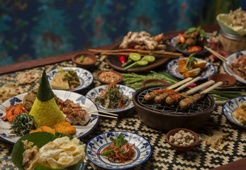 Freshly prepared delicious varieties of dishes on table. Many food dishes on table