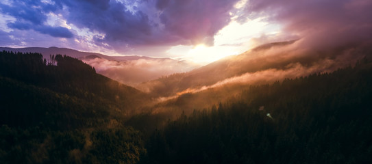 Obraz premium beautiful aerial view of the mountains and the blue lake, the sunset after the rain, high resolution panorama, the purple clouds, Best place in, tourism and nature concept, the Carpathians Ukraine