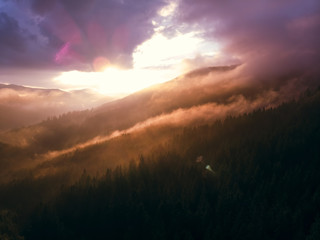 beautiful aerial view of the mountains and the blue lake, the sunset after the rain, the coniferous forest, the purple clouds, Best place in, tourism and nature concept, the Carpathians Ukraine