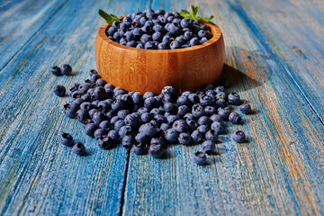 Fresh blueberries on the table in a deep dish, the chef prepared it for filling for croissants