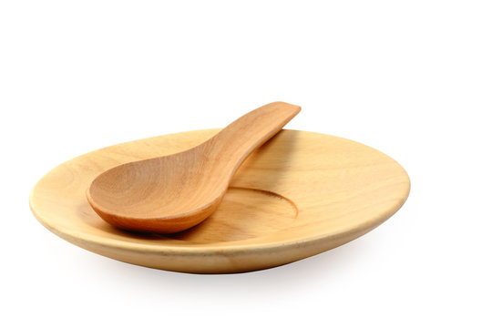 Wooden plate and tablespoon isolated clipping path.