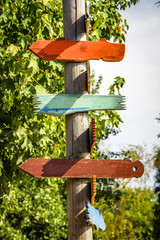 Wooden sign shaped like arrows