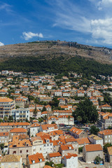 Fototapeta na wymiar Houses of Dubrovnik, Croatia, at Foot of Mountain
