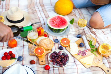 Summer Picnic Basket on the Green Grass. Food and drink concept. Friends Party time