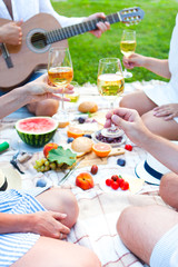 Summer Picnic Basket on the Green Grass. Food and drink concept. Friends Party time