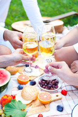 Summer Picnic Basket on the Green Grass. Food and drink concept. Friends Party time
